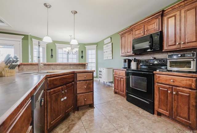 kitchen featuring light tile patterned floors, sink, stainless steel counters, hanging light fixtures, and black appliances