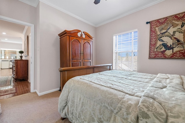 bedroom with crown molding, light colored carpet, and ceiling fan