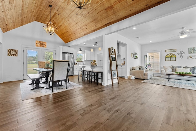 dining area featuring high vaulted ceiling, hardwood / wood-style flooring, and wooden ceiling