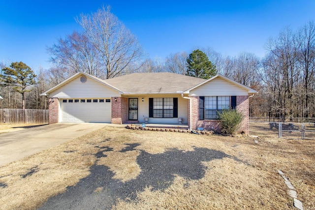 ranch-style house featuring a garage and covered porch