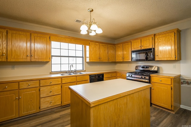 kitchen featuring sink, a center island, a textured ceiling, pendant lighting, and black appliances