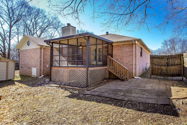 back of house with a patio area, a sunroom, and ceiling fan