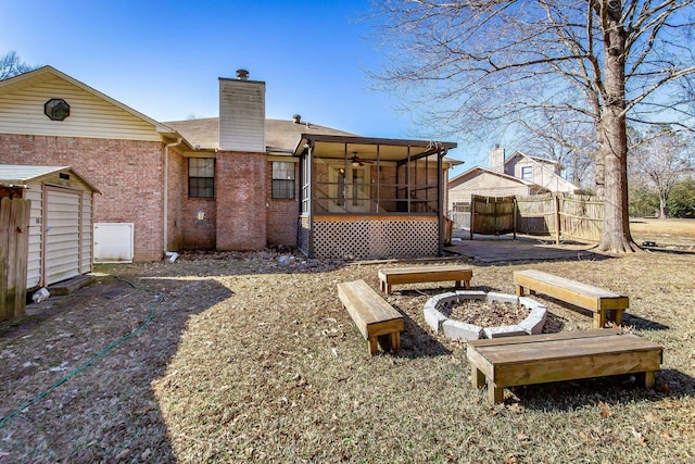 back of property with a sunroom