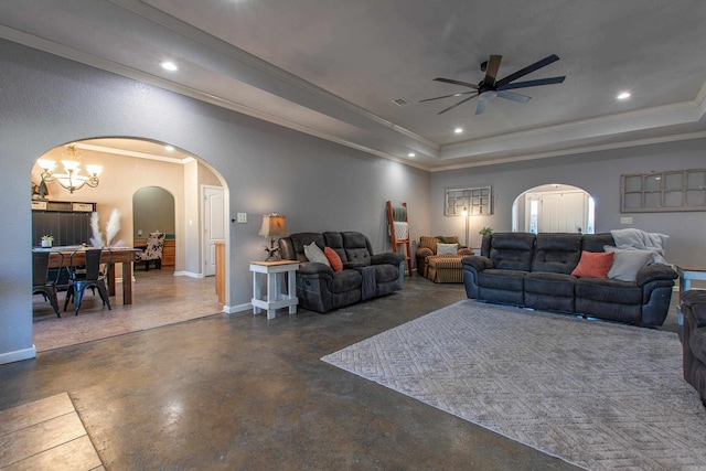 living room featuring crown molding, ceiling fan, and a tray ceiling