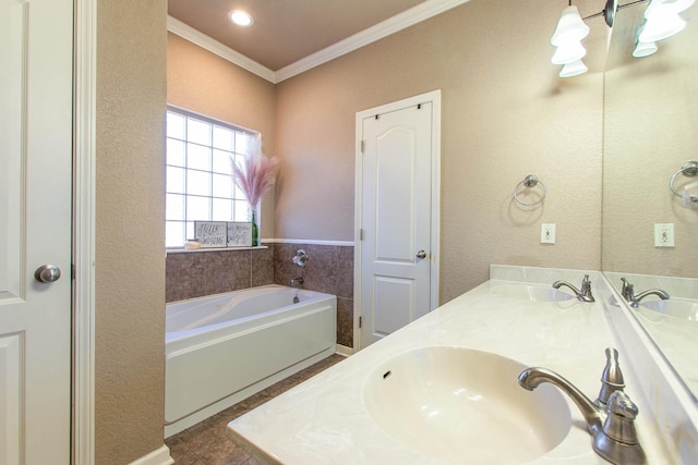 bathroom with tile patterned flooring, crown molding, a bathing tub, and vanity