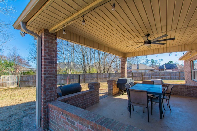 view of patio featuring a grill and ceiling fan