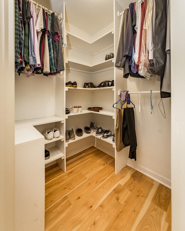 walk in closet featuring hardwood / wood-style floors