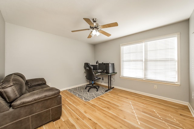 office with hardwood / wood-style floors and ceiling fan