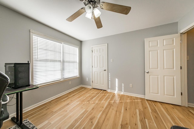 unfurnished office featuring ceiling fan and light hardwood / wood-style flooring