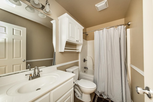 full bathroom with shower / bathtub combination with curtain, vanity, and toilet