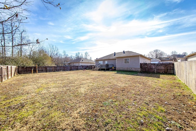 view of yard with a wooden deck