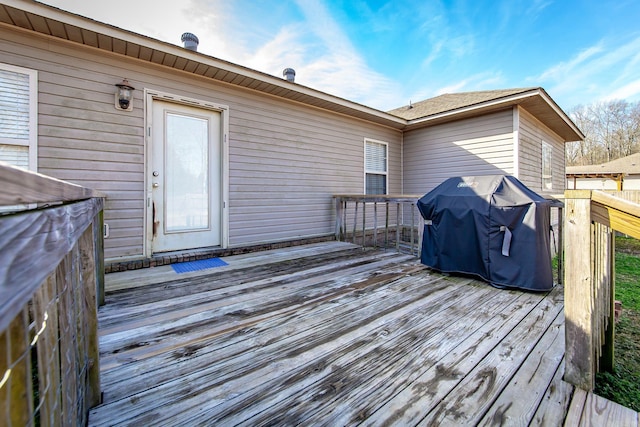 wooden deck with grilling area