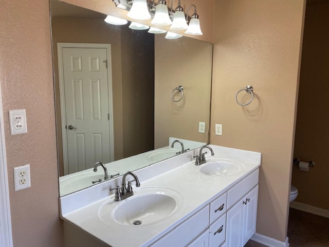 bathroom with vanity and toilet