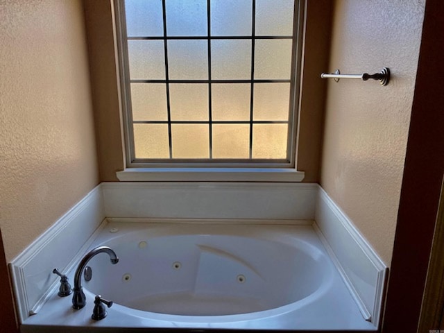 bathroom featuring a washtub