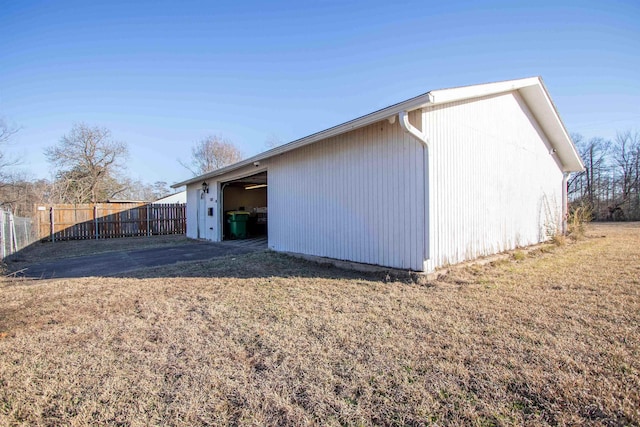 rear view of property featuring a yard