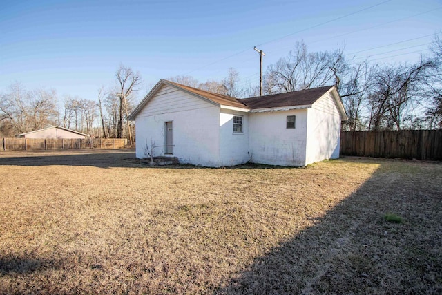 rear view of house with a lawn