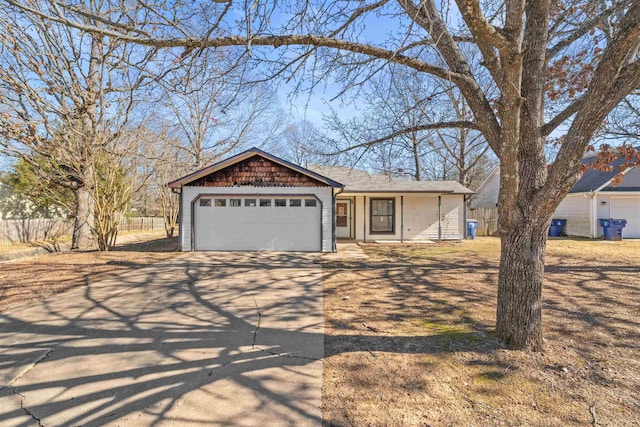 ranch-style home featuring a garage