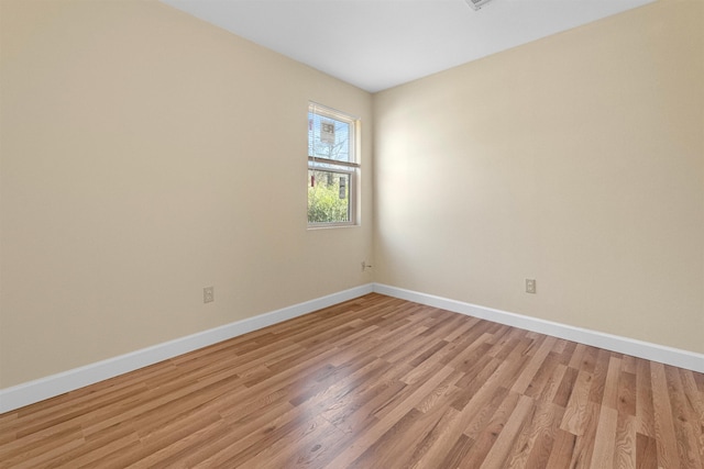 unfurnished room with light hardwood / wood-style floors