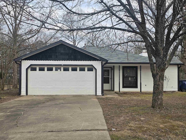 single story home with a garage