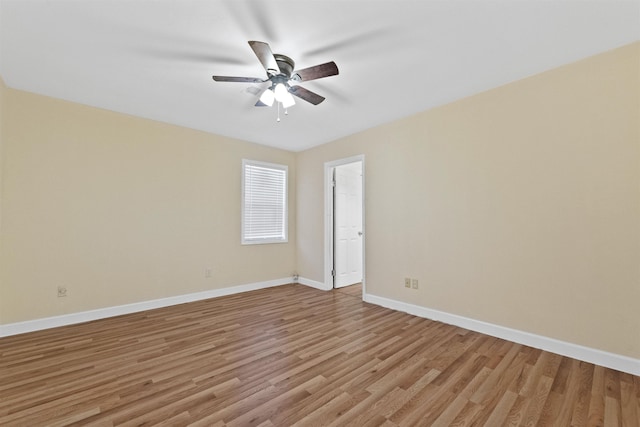 spare room featuring light hardwood / wood-style flooring and ceiling fan