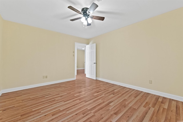 unfurnished room with ceiling fan and light wood-type flooring