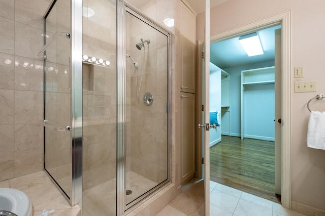 bathroom featuring tile patterned floors and walk in shower