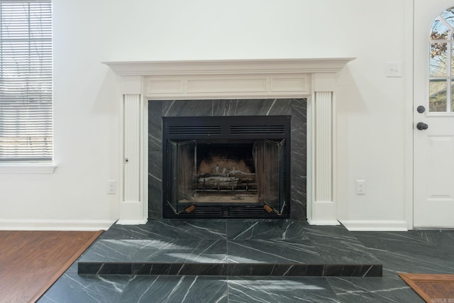 interior details featuring a high end fireplace