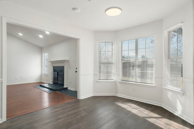 unfurnished living room featuring dark hardwood / wood-style flooring