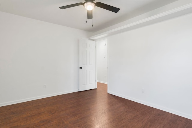 spare room featuring ceiling fan and dark hardwood / wood-style floors