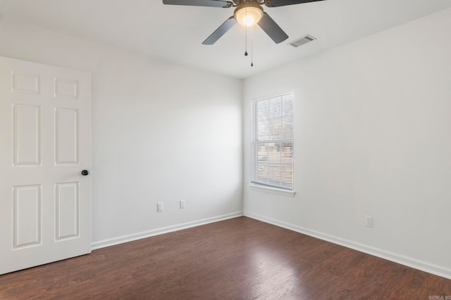 unfurnished room featuring ceiling fan and dark hardwood / wood-style flooring