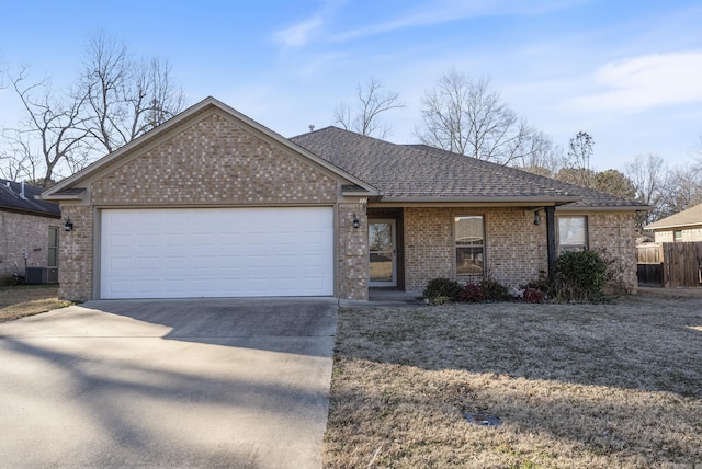 ranch-style home featuring a garage and central AC