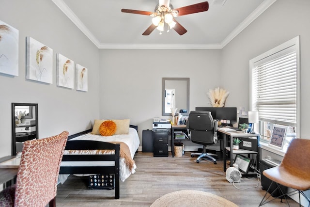 bedroom with ornamental molding, light hardwood / wood-style floors, and ceiling fan