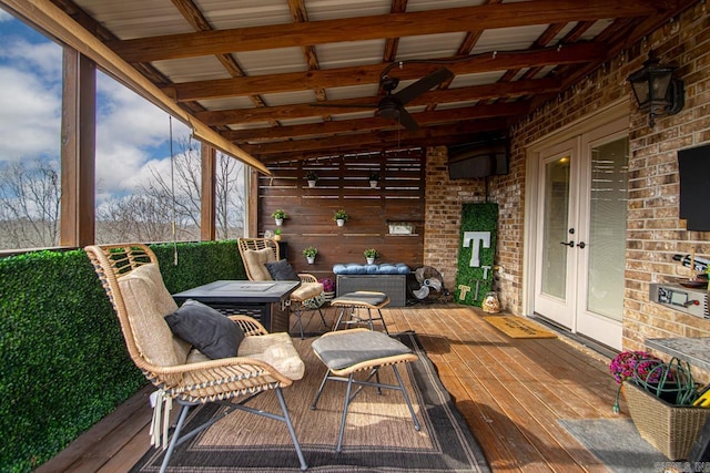 deck featuring french doors and ceiling fan