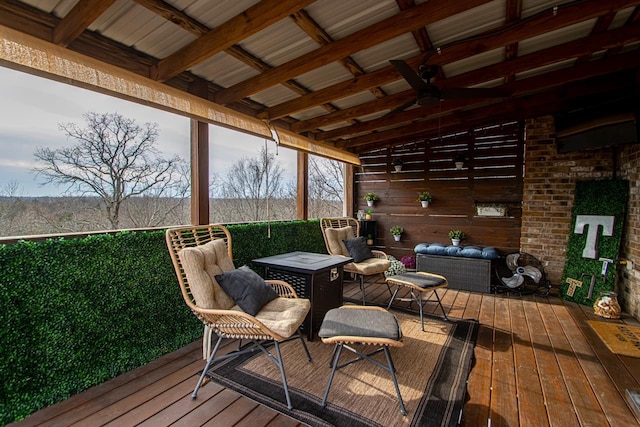 deck featuring an outdoor living space and ceiling fan