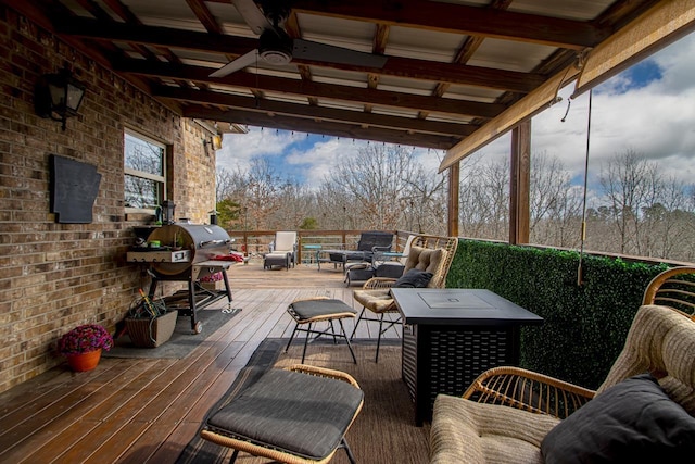 deck featuring area for grilling, an outdoor hangout area, and ceiling fan