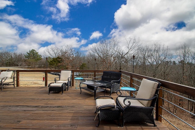 wooden deck featuring a fire pit