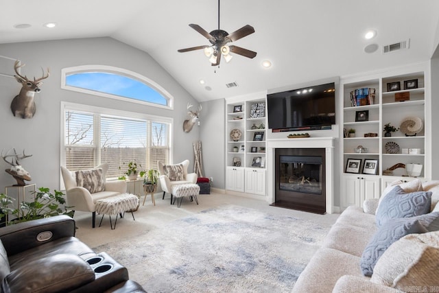 carpeted living room with lofted ceiling, built in features, and ceiling fan