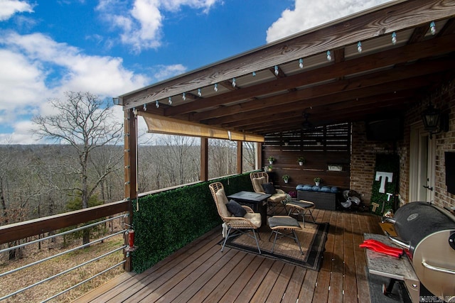 wooden terrace with area for grilling