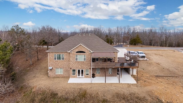 back of property with a patio and a deck