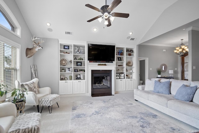 living room with ceiling fan with notable chandelier, vaulted ceiling, built in features, and carpet