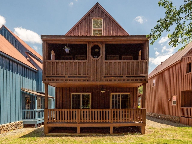 rear view of property featuring a balcony