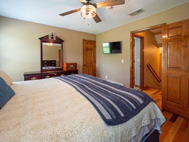 bedroom featuring ceiling fan and hardwood / wood-style floors