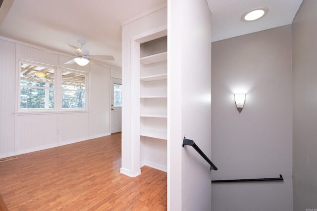 interior space with ceiling fan and light hardwood / wood-style floors