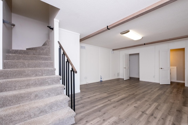 basement with hardwood / wood-style floors