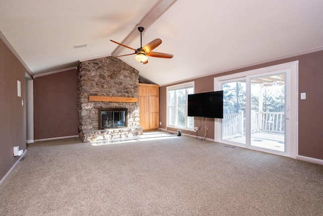 unfurnished living room with carpet floors, a stone fireplace, vaulted ceiling with beams, and ceiling fan