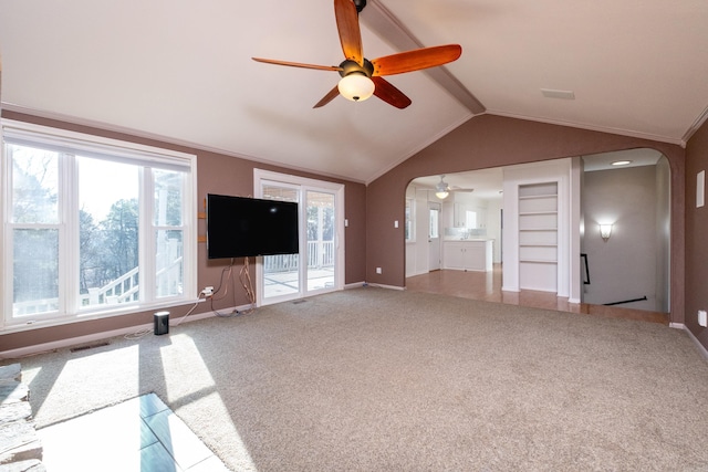 unfurnished living room with vaulted ceiling with beams, carpet floors, and ceiling fan