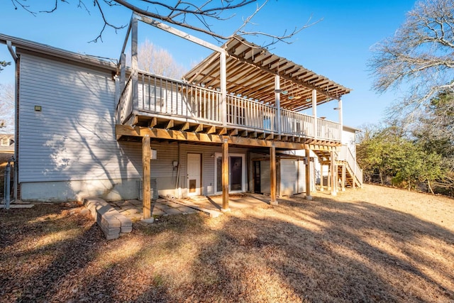 back of property featuring a wooden deck