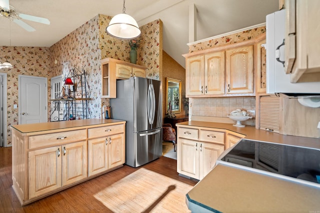 kitchen featuring stainless steel refrigerator, ceiling fan, light hardwood / wood-style floors, decorative light fixtures, and light brown cabinets