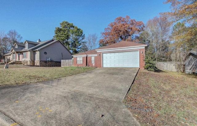 view of side of property featuring a yard and a garage