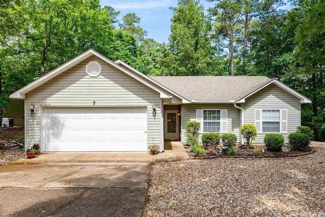 single story home featuring a garage